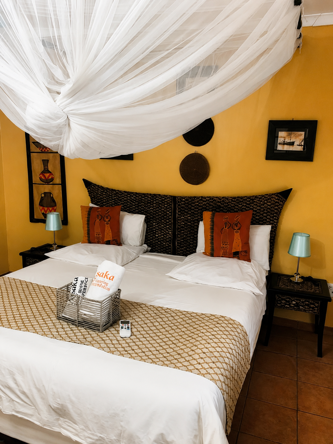 Elegant luxury suite at Rafiq Luxury Apartments with canopy bed and warm timber ceiling
